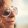 white sunglasses Closeup portrait of a woman in white sunglasses